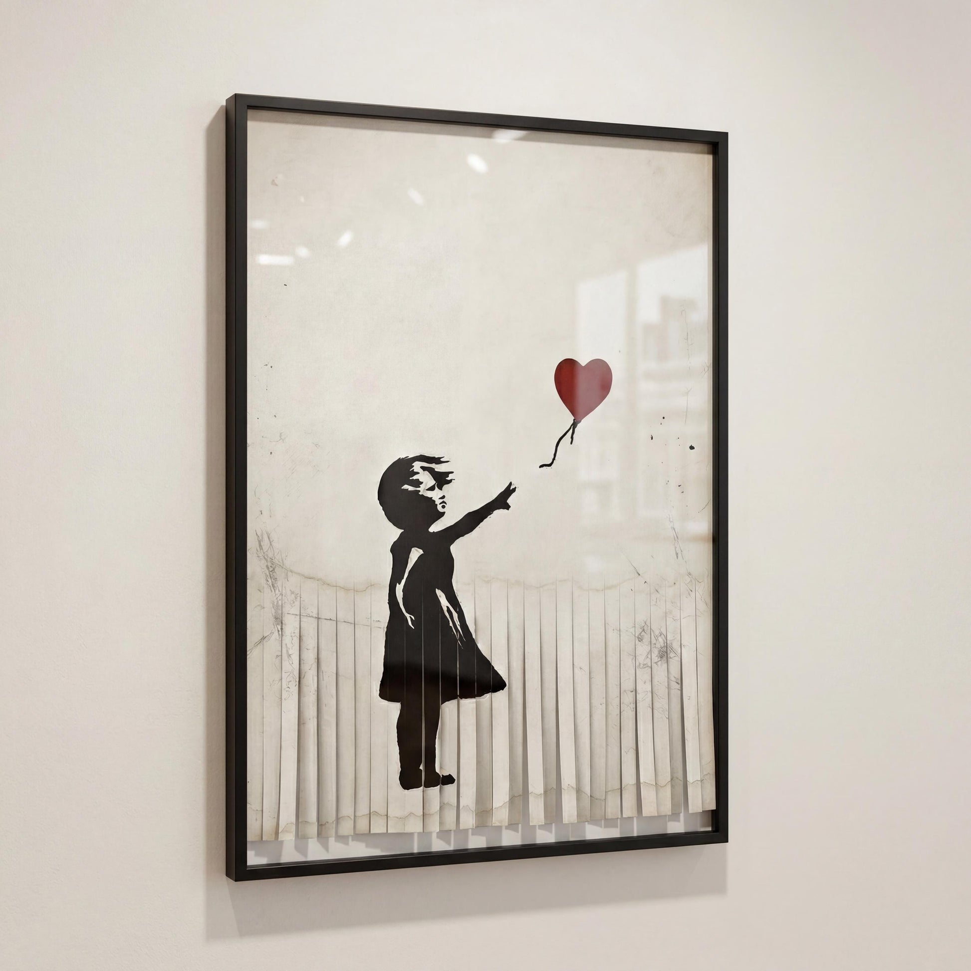 A framed artwork depicting a young girl holding a heart-shaped balloon.