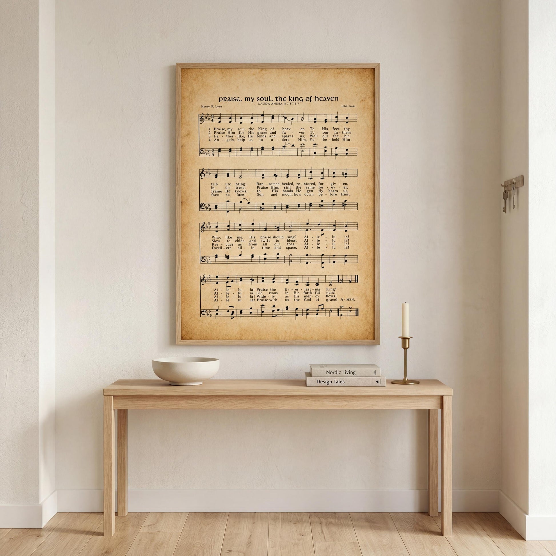 a wooden table with a bowl on it, and a framed sheet of music is hanging on the wall above the table.