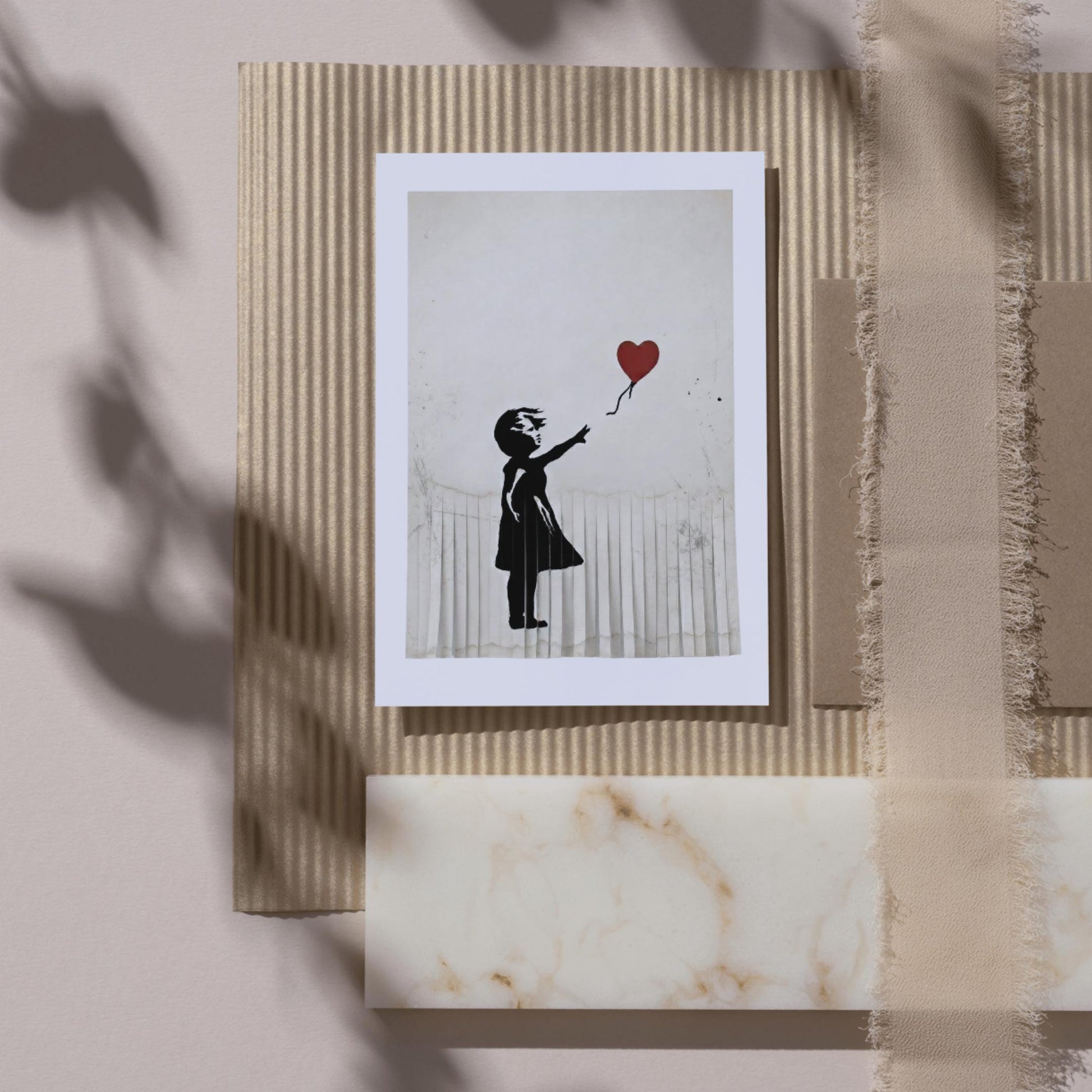 a black silhouette of a person holding a heart-shaped balloon.