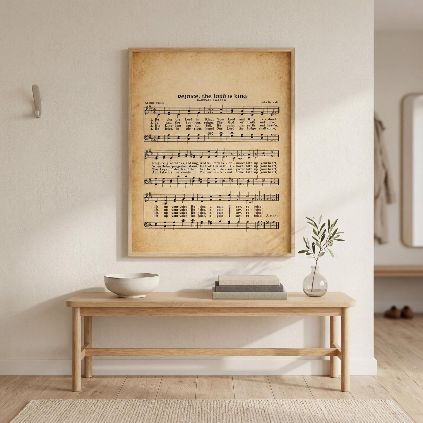 a wooden console table with a bowl and a vase on top, and a framed sheet of music with lyrics hanging on the wall above it.