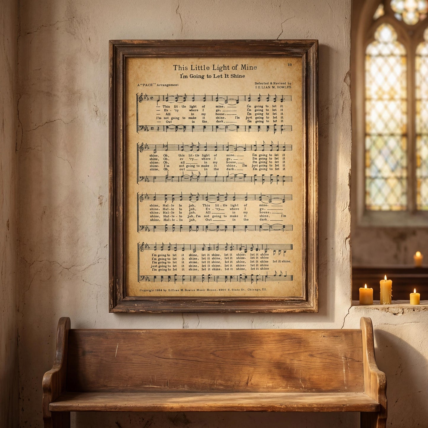 a framed sheet music of a song titled "This Little Light of Mine" with a wooden bench in the foreground and a window in the background.