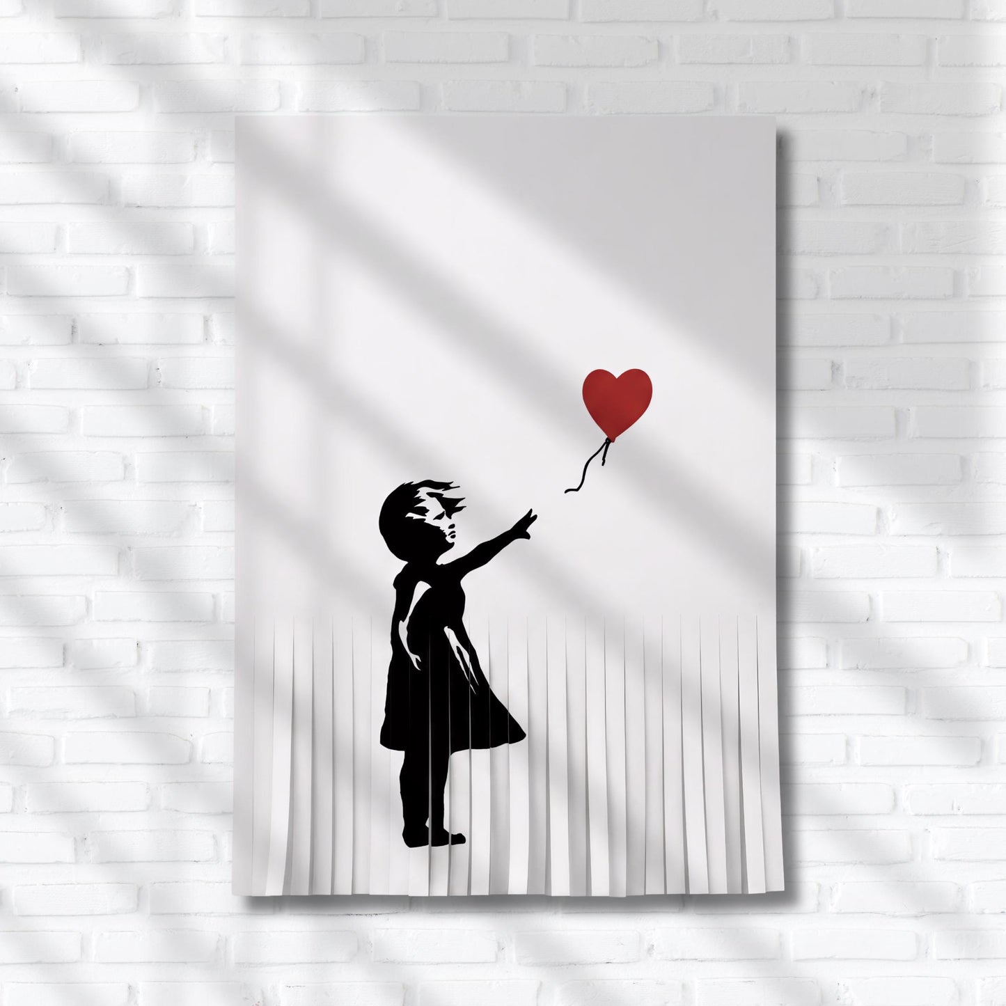 A black and white silhouette of a person holding a red heart-shaped balloon.