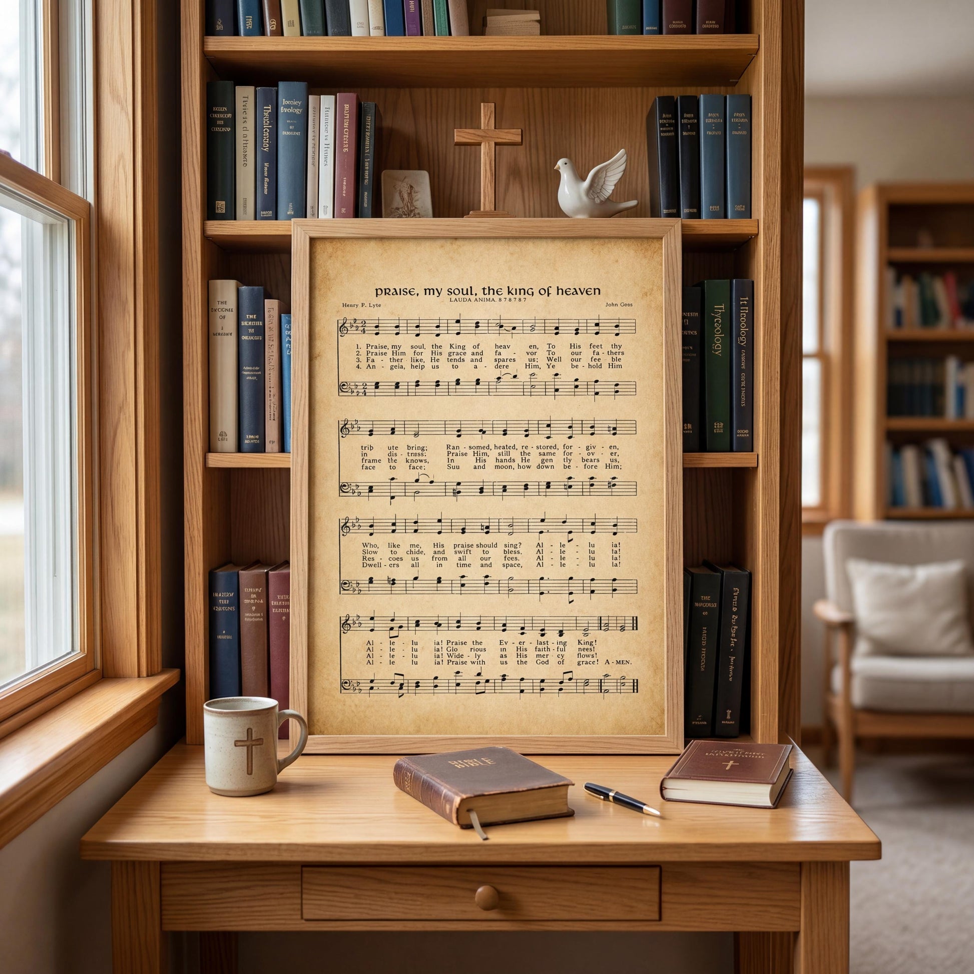 A wooden desk with a framed sheet music of a hymn, a coffee mug, a book, and a pen, all set against a backdrop of a bookshelf filled with books.