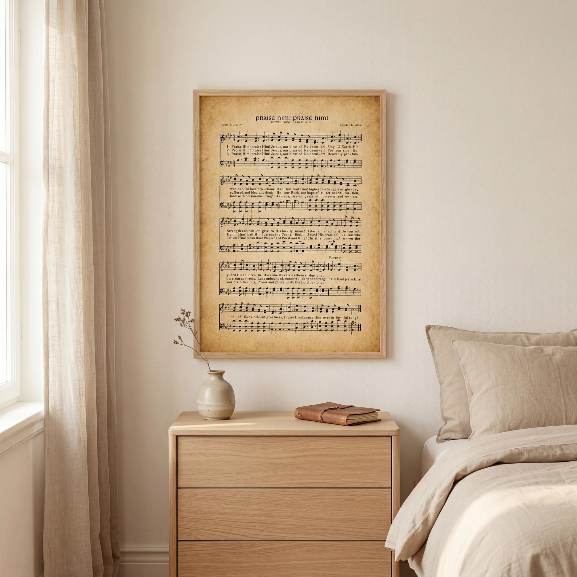 a bedroom setting with a framed sheet music poster of a hymn hanging on the wall above a wooden nightstand.