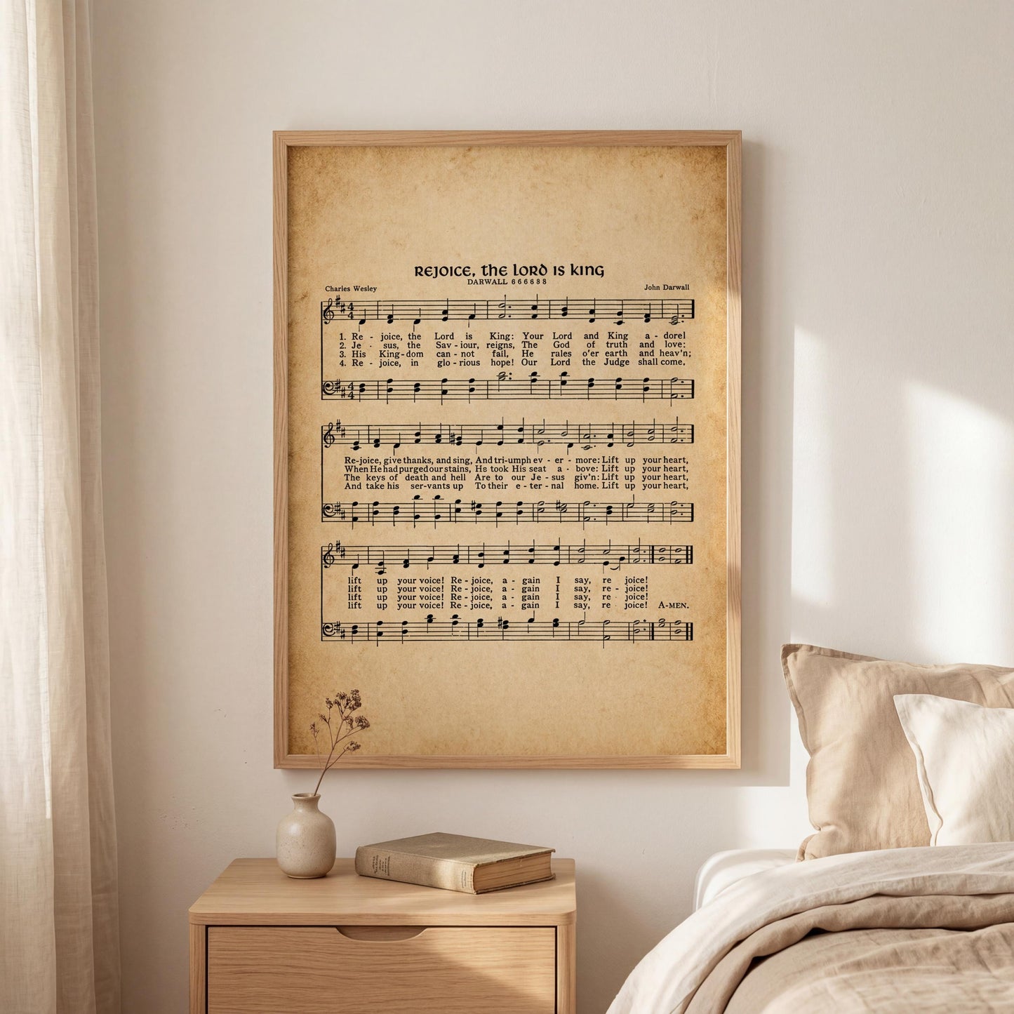 a framed sheet music print of a hymn titled "Rejoicing, the Lord is king" hanging on a wall above a wooden nightstand with a vase of flowers and a book.