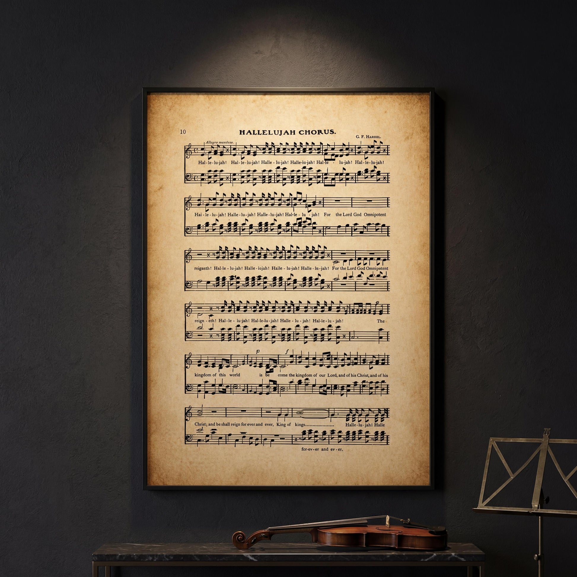 a framed sheet of music with the title "Hallelujah Chorus" and the artist's name "G. F. Hahnel". The sheet music appears to be an old, vintage style, and there is a violin resting on a table in the foreground.