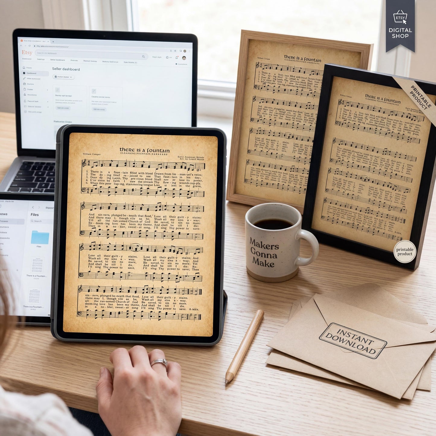 a desk with various items, including a laptop, a framed sheet of music, a coffee mug, and some envelopes. A person is sitting at the desk, likely working or enjoying some leisure time.