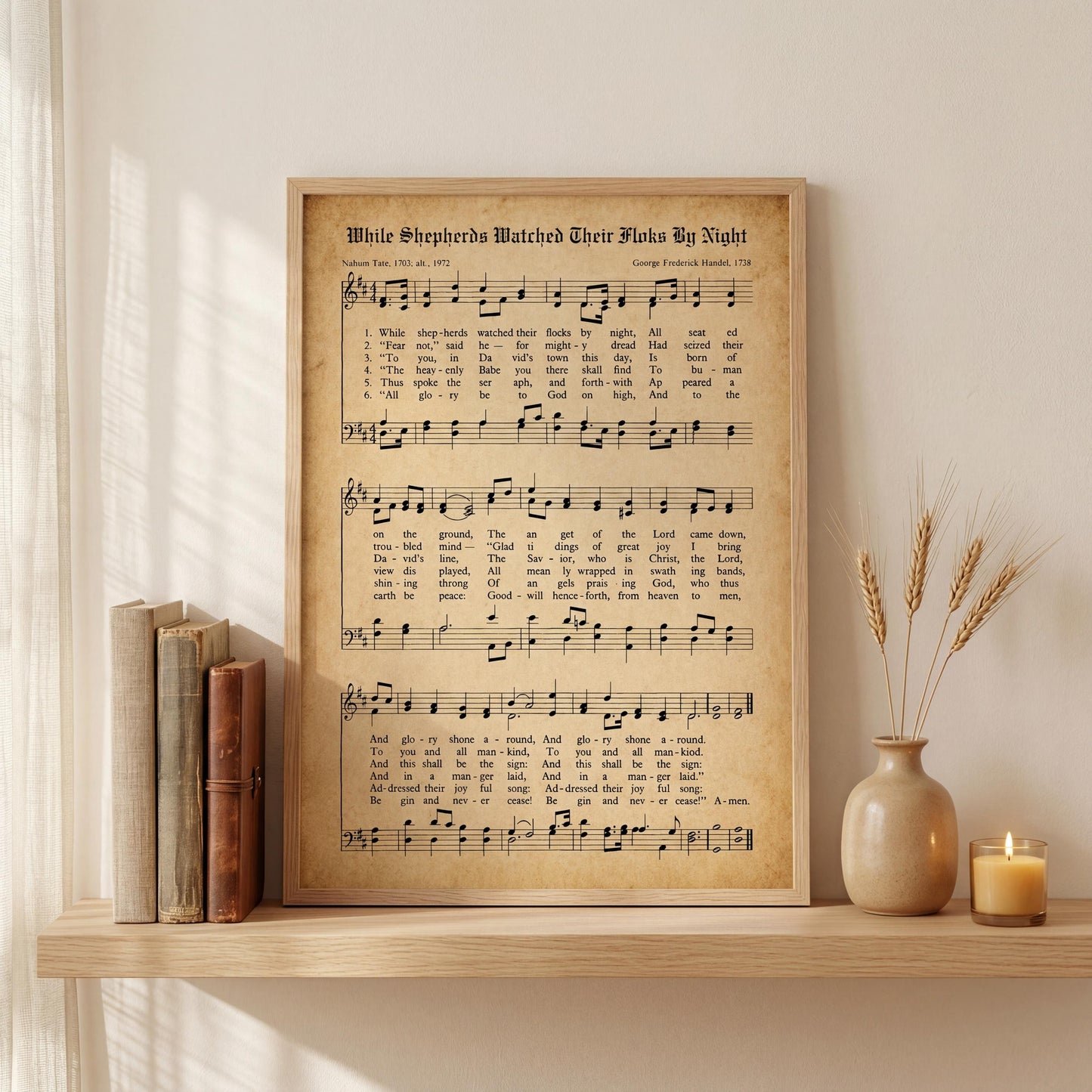 a framed sheet music print of a song titled "White Shepherds Watch Their Flies By Night" with a candle and some books on a shelf.