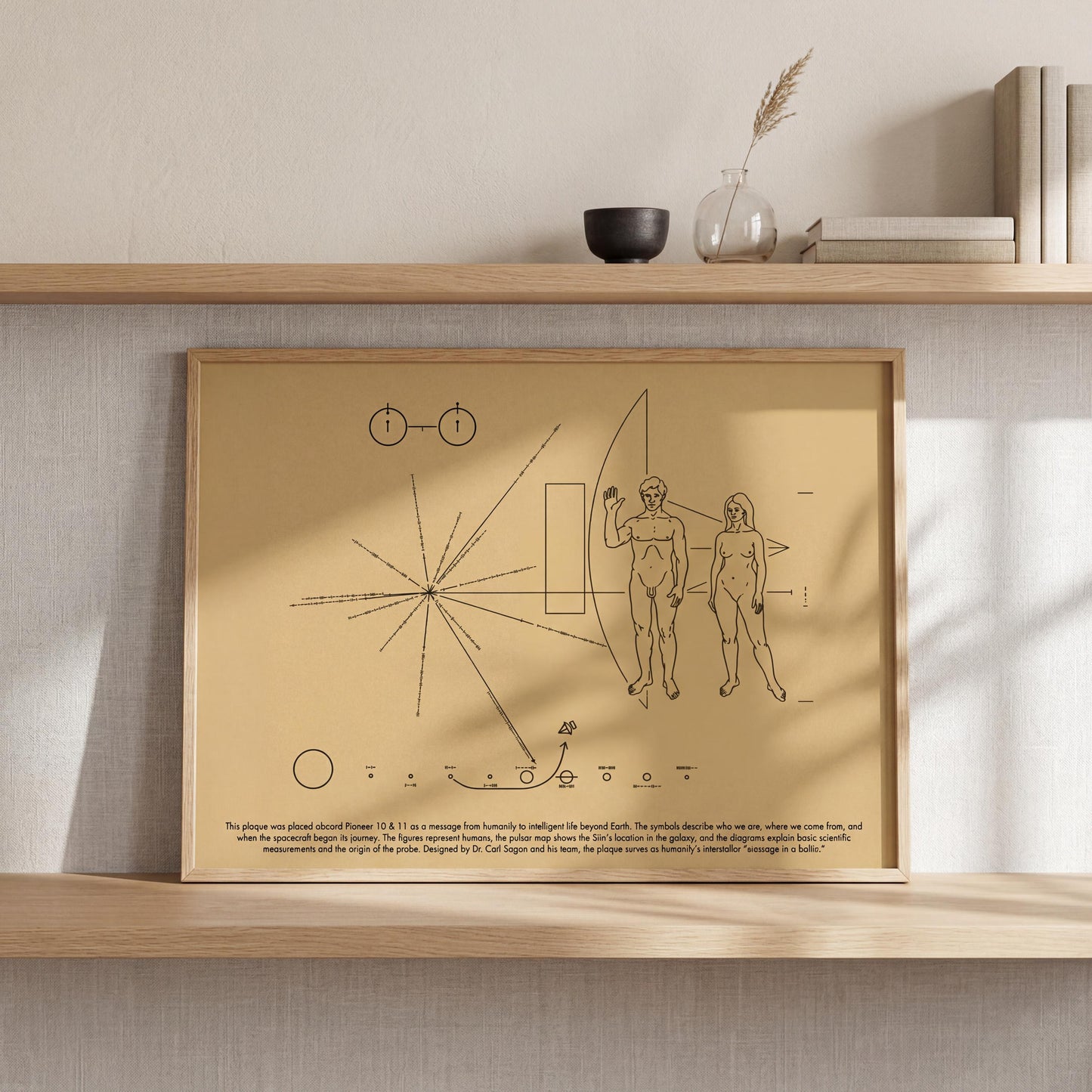 a framed artwork depicting a spacecraft and two figures, with text below the artwork.