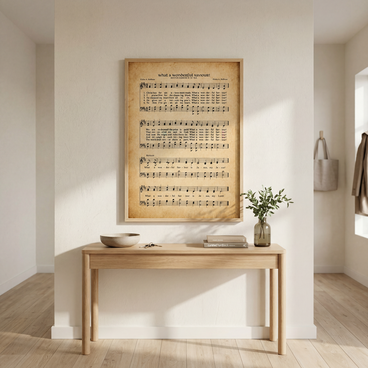 a wooden table with a bowl and a vase on it, set against a white wall with a framed sheet music poster hanging above it.